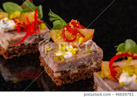 Small black bread and souffle sandwich from a fish 46689781