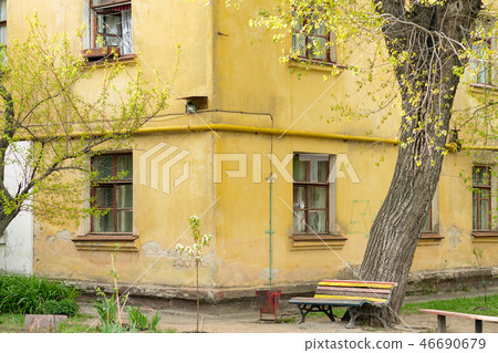 Bench on the corner of old building Bench on the corner of old building 46690679