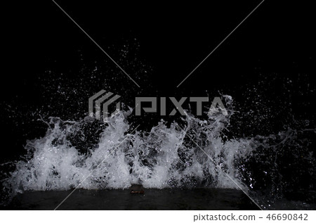 Splashing wave on the Black sea in the night. 46690842