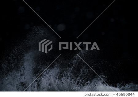 Splashing wave on the Black sea in the night. 46690844