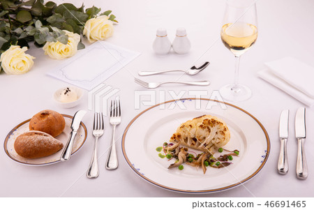 A stake from a cauliflower with coconut sauce, gre A stake from a cauliflower with coconut sauce, gre 46691465