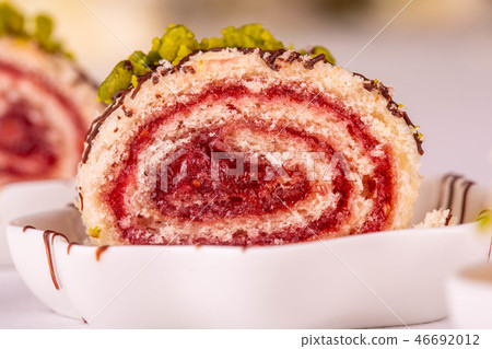 Swiss roll with a layer from strawberry mousse Swiss roll with a layer from strawberry mousse 46692012