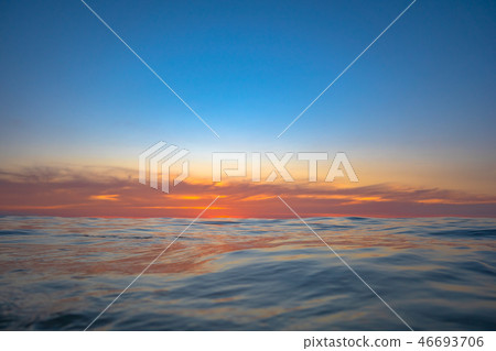 the sun going down to the sea 46693706