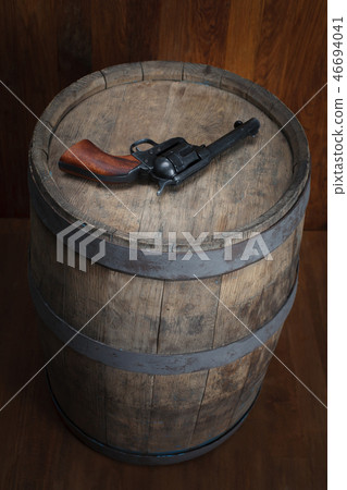 Old western revolver with cartridges 46694041