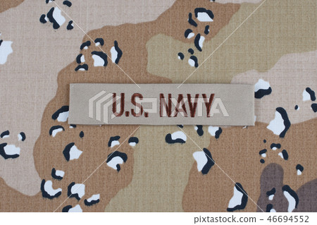 US NAVY branch tape on desert uniform background 46694552