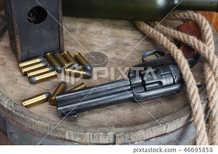 Old western revolver with cartridges Old western revolver with cartridges 46695858