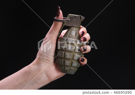 fragmentation grenade in woman hand fragmentation grenade in woman hand 46695890