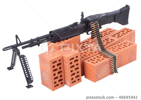 machine gun with amminition tape on position 46695942
