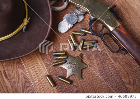 Wild west rifle, ammunition and sheriff badge 46695975
