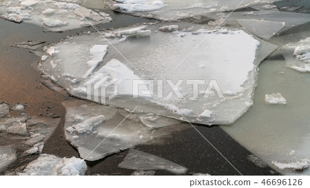 broken ice on a winter river with sunset sky reflection broken ice on a winter river with sunset sky reflection 46696126