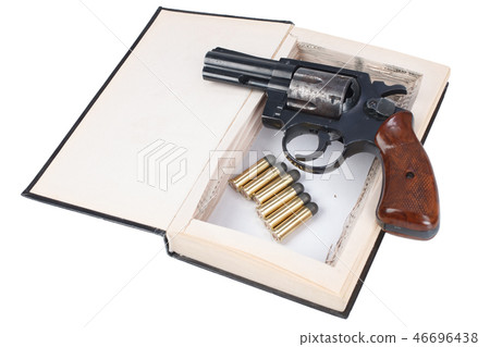 revolver gun with cartridges hidden in a book 46696438