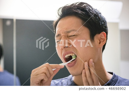 Toothpaste of young Japanese men who are brushing teeth Toothpaste of young Japanese men who are brushing teeth 46698902