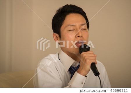 Young businessman singing karaoke Japanese men Young businessman singing karaoke Japanese men 46699311