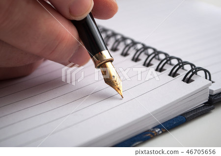 hand of woman writing with vintage pen hand of woman writing with vintage pen 46705656