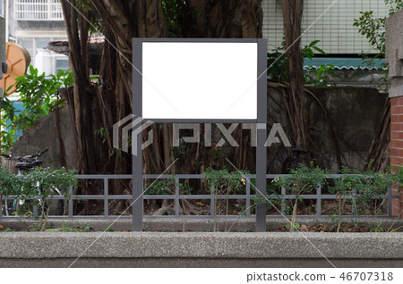Large blank billboard on a street wall 46707318