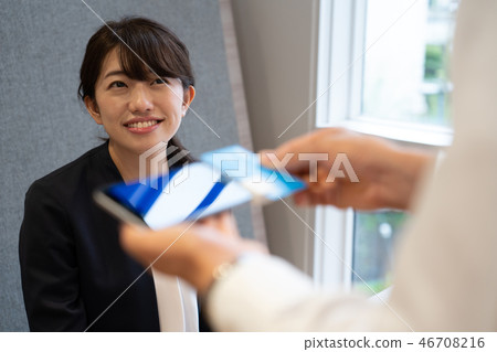 Woman doing cashless payment 46708216