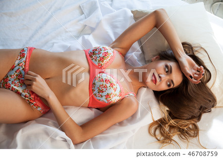 beautiful woman in underwear in the bedroom on the bed in the morning beautiful woman in underwear in the bedroom on the bed in the morning 46708759