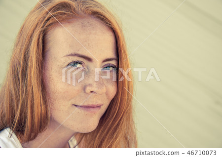 Young girl with red hair and freckles. Toned. 46710073