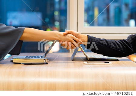Men and women shaking hands Men and women shaking hands 46710291