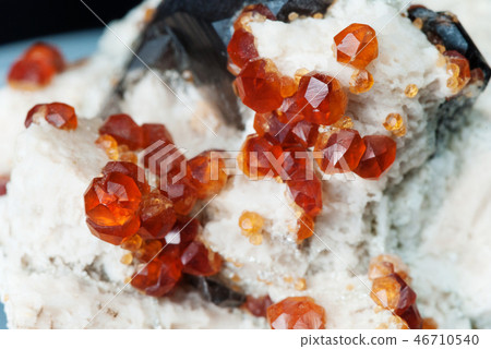 Orange crystals of spessartite garnet Orange crystals of spessartite garnet 46710540