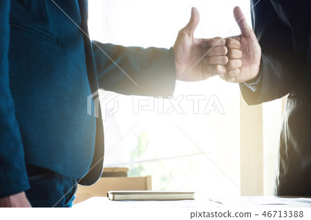 businessmen with thump up businessmen with thump up 46713388