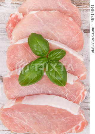 Fresh loin with basil for cooking lunch or dinner Fresh loin with basil for cooking lunch or dinner 46714041