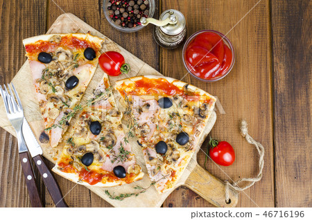 Sliced pizza with mozzarella cheese, ham, olives Sliced pizza with mozzarella cheese, ham, olives 46716196