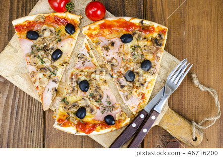 Sliced pizza with mozzarella cheese, ham, olives Sliced pizza with mozzarella cheese, ham, olives 46716200