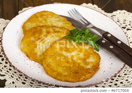 Vegetable rosti, golden fried potato pancakes 46717008
