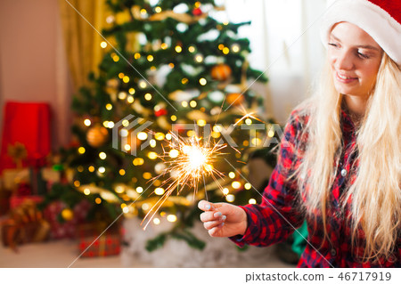 Woman holds the bengal light, holiday concept Woman holds the bengal light, holiday concept 46717919