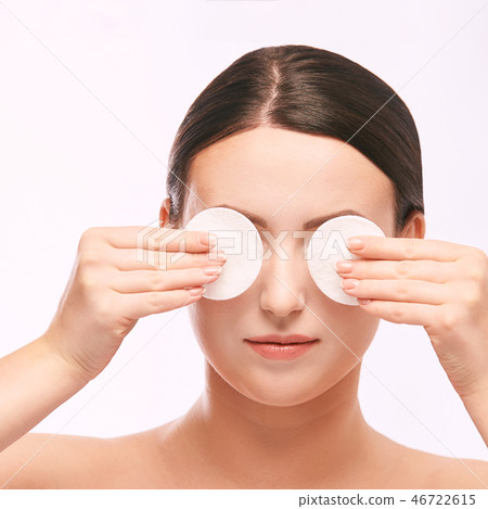 Home face care. Girl remove makeup. Woman hand Home face care. Girl remove makeup. Woman hand 46722615