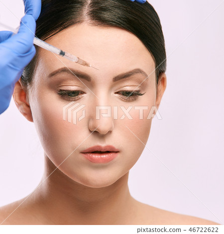 Face needle injection. Young woman cosmetology 46722622
