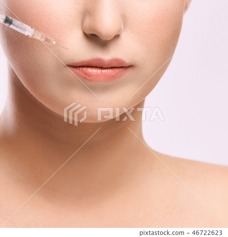 Face needle injection. Young woman cosmetology  46722623