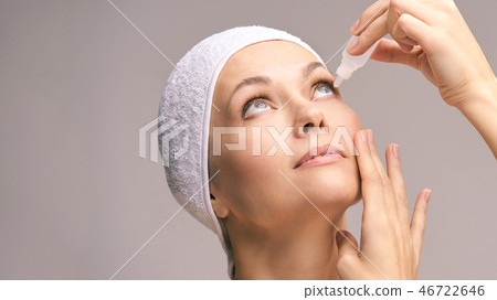 Woman using eye drops. Medicine treatment.  46722646