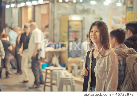 traveler girl in the night street of Hong Kong traveler girl in the night street of Hong Kong 46722972