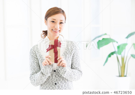 A woman with a present A woman with a present 46723650