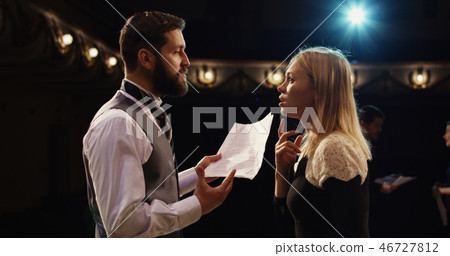 Actors rehearsing in a theater Actors rehearsing in a theater 46727812
