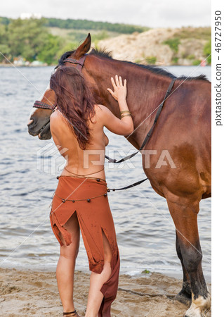 horse and beautiful naked woman on river beach 46727950