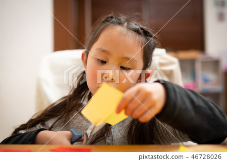 Girls playing with origami 46728026