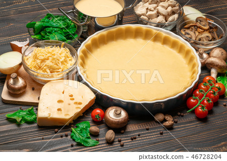 shortbread dough for baking quiche tart in baking form and ingredients shortbread dough for baking quiche tart in baking form and ingredients 46728204