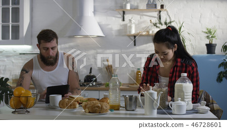 Couple talking during breakfast Couple talking during breakfast 46728601