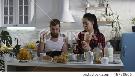 Man and woman talking during breakfast Man and woman talking during breakfast 46728606