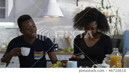 Man and woman talking during breakfast 46728618
