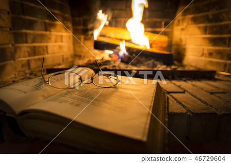 open book beside fireplace open book beside fireplace 46729604