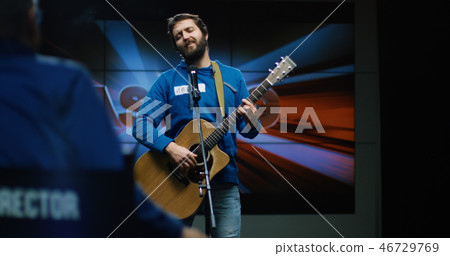 Young man singing Young man singing 46729769