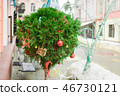 Tuya in the shape of a ball is decorated as a New Year link with red balls and tree toys on the 46730121