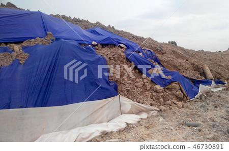 Temporary slope protection use the plastic sheet Temporary slope protection use the plastic sheet 46730891