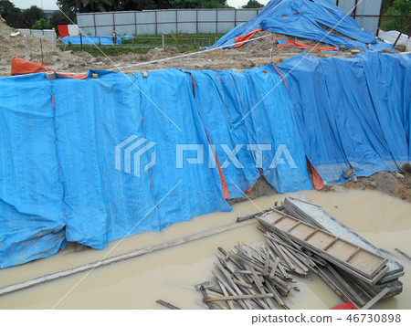 Temporary slope protection use the plastic sheet Temporary slope protection use the plastic sheet 46730898