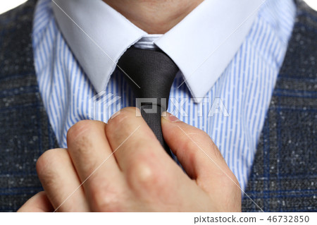 Male arm in blue suit set tie closeup 46732850