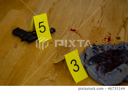Bullets, bloody clothes and gun at crime scene Bullets, bloody clothes and gun at crime scene 46735144